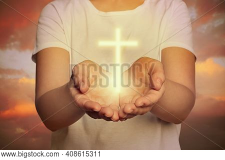 Woman And Cross Silhouette Outdoors, Closeup View. Belief In Jesus Christ