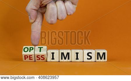 Pessimism Or Optimism Symbol. Businessman Turns Cubes And Changes The Word 'pessimism' To 'optimism'