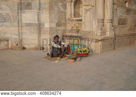 Old Man Selling Corn On The Counter In A Touristic Area. An Indian Street Vendor Selling Roasted Cor