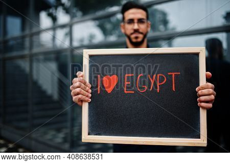 I Love Egypt. Middle Eastern Man Wear Blue Shirt, Eyeglasses, Hold Board.