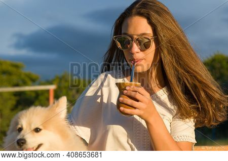 Blonde Woman Taking Traditional Gaucho Chimarrao