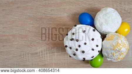 Easter Cakes With Sugar Glaze And Colored Painted Eggs On Wooden Background. Happy Easter Easter Car