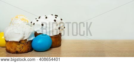 Easter Cakes With Sugar Glaze And Colored Painted Eggs On Wooden Background. Happy Easter Easter Car