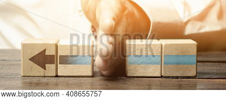 Man Divides The Arrow Blocks Into Two Parts. Interruption Of The Process, Decreased Activity. Stop F