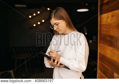 Businesswoman Or Student Writing Down Notes , Isolated On Black Background.inspired Creative Woman W