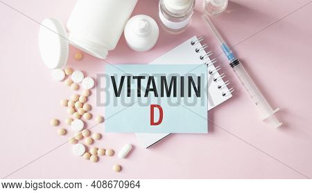 Vitamin D Words On Notebook And Pills, Medical Concept.