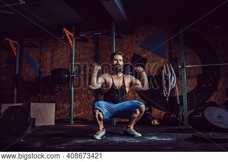 Muscular Fitness Man Preparing To Deadlift A Barbell Over His Head In Modern Fitness Center. Functio