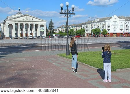 Chernihiv - Ukraine. 24 April 2018: Girls Take Pictures On Central Area Of Chernihiv. Happy Children