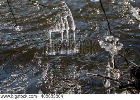 Light Reflected Through Icicles At A River In Winter Time