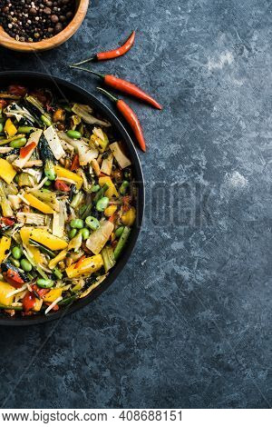 Fresh Asian Vegetables Mix, Thai Wok In A Black Pan On The Black Background With Copy Space. Healthy