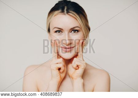 Young Adult Doing Facial Gymnastics Self Massage And Rejuvenating Exercises Face Building For Skin A