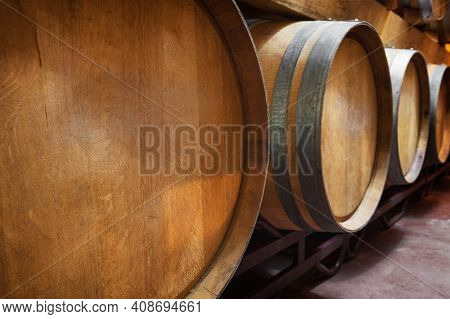 Cellar With Barrels Of Wine. High Quality Photo