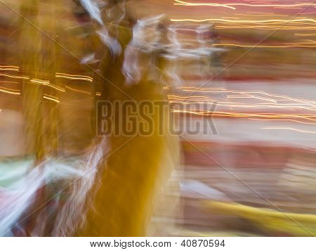 Carousel Horses In A Merry Go Round With Colorful Motion Blur
