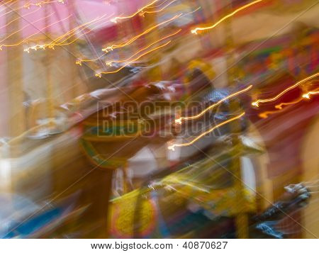 Carousel Horses In A Merry Go Round With Colorful Motion Blur