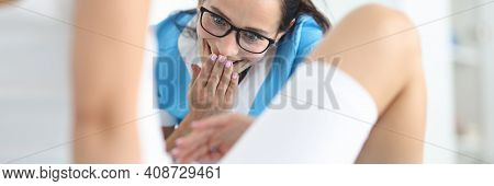 Woman Gynecologist In Glasses Examines Patient In Clinic Office With Surprise Portrait. Removal Of F
