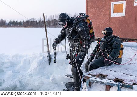 Russia, River Volga Kama - Jan 17th 2020. Diver Before Scuba Ice Diving. Outdoor Winter Diving Under