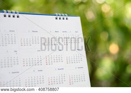 Desktop Calendar 2021 Place On Wooden Office Desk With Boke Background. Calender For Planner Timetab