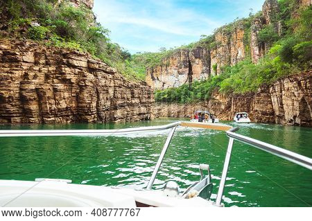 Pov Of Tourist Boats Navigating Between Canyons Of Sedimentary Rocks And The Green Water Of The Lake