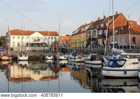 Bornholm, Denmark - August 6, 2020: Sailboats Anchored At The Small Harbor In Allinge