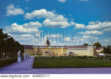 Karlsruhe Castle On A Sunny Day With Park In Front