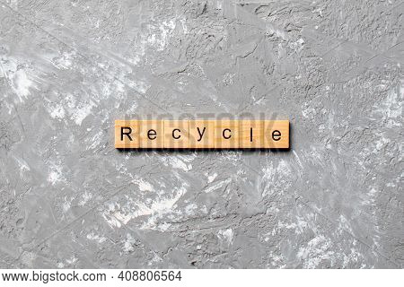 Recycle Word Written On Wood Block. Recycle Text On Cement Table For Your Desing, Concept.
