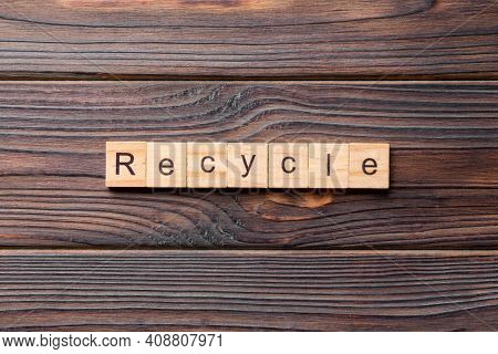 Recycle Word Written On Wood Block. Recycle Text On Cement Table For Your Desing, Concept.
