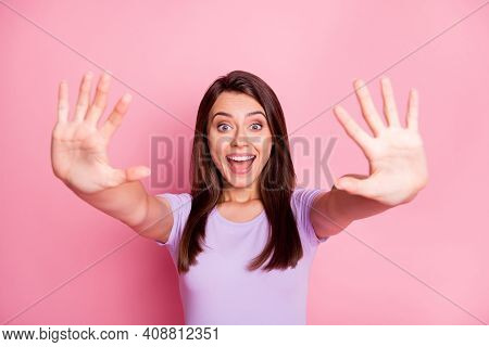 Portrait Of Amazed Young Lady Show Ten Fingers Wear Casual Violet Cloth Isolated On Pink Color Backg