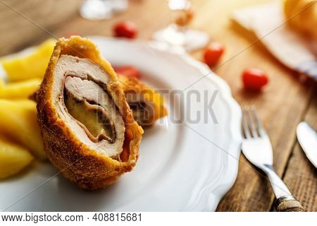 Traditional French Cuisine Chicken Roll Cordon Bleu Or Gordon Blue With Cheese, Ham And Potatoes