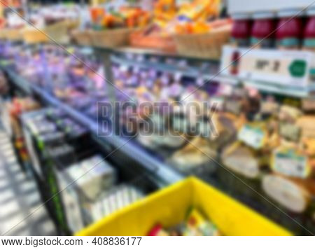 Blurred View Of Interior Of Large Food Shopping Center.