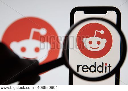London, Uk - February 2021: Reddit Logo Seen Under A Magnifying Glass