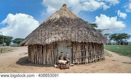 Omo Valley, Ethiopia, September 2017: Karo Tribe Children Holding A Goat