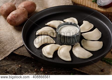 Appetizing Traditional Russian Dumplings, Hand-made With Potatoes. Still Life On A Wooden Board. Clo