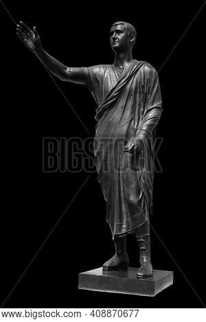 Statue of Roman statesman, lawyer, orator and philosopher. Isolated on black. Ancient antique roman sculpture