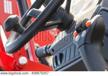 Steering Wheel And Operating Control Panel In Agricultural Or Industrial Machine. Detail Of Vehicle