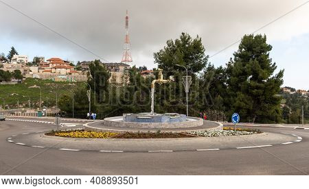 Zefat, Israel, February 13, 2021 : A Fountain In The Form Of A Faucet With Water Flowing Out Of It S