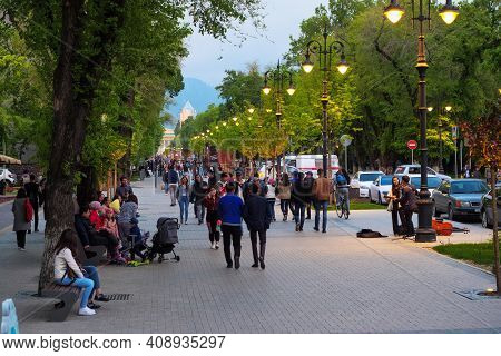 Almaty, Kazakhstan - April 29, 2019: People Walk Down The Street. City Street In The Evening. Panfil