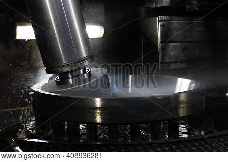 Bearing Machining On The Machine. Bearing Processing Machine. Splashes Are Out Of Focus. Bearing Pla