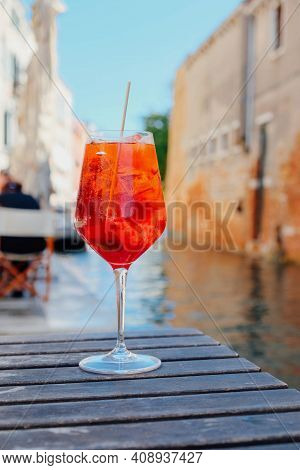 Glass Of Refreshing Aperol Spritz Cocktail Served On The Deck Bar In Venice.