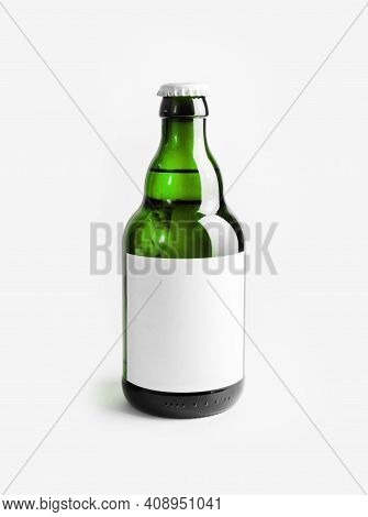 Green Beer Bottle With Blank Label. Template For Placing Your Design. Vertical Shot.