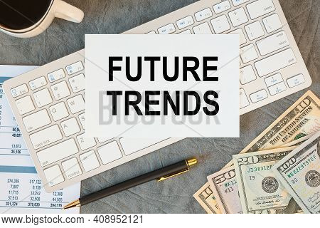Future Trends Is Written In A Document On The Office Desk With Office Accessories, Coffee, Money And