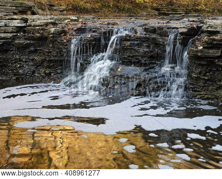 Autumn Color Is Reflected Into Liquid Gold In The Splash Pool At Waterfall Glen Falls At Waterfall G
