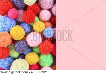 Colored Ball Of Yarn For Knitting, Crocheting. Yarn For Knitting In All Colors With A Pink Backgroun