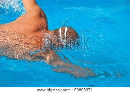 Man In Pool With Swimming Goggles