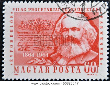 A stamp printed in Hungary shows image of Karl Marx famous communism sociologist