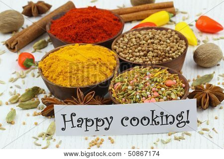 Happy cooking card with selection of spices and chilies