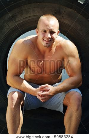 Athletic strong bodybuilder, execute exercise training in sport gym hall