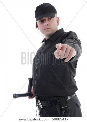 Policeman wearing black uniform pointing in ordering manner