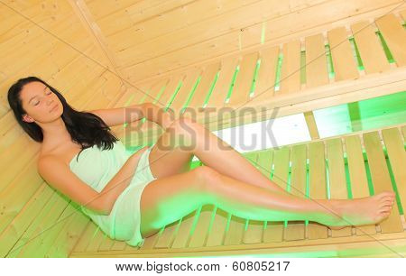 Pretty girl in the small sauna