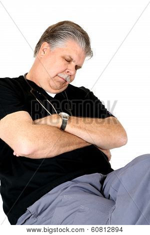 Exhaused Medical Doctor Asleep Sitting In A Chair
