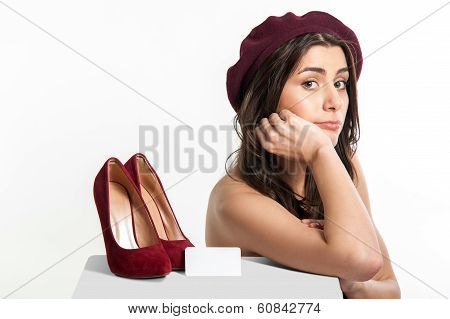 Sad woman near shoes